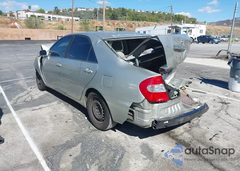 2003 Toyota Camry Le z USA, uszkodzony, nr VIN JTDBE32KX30154150